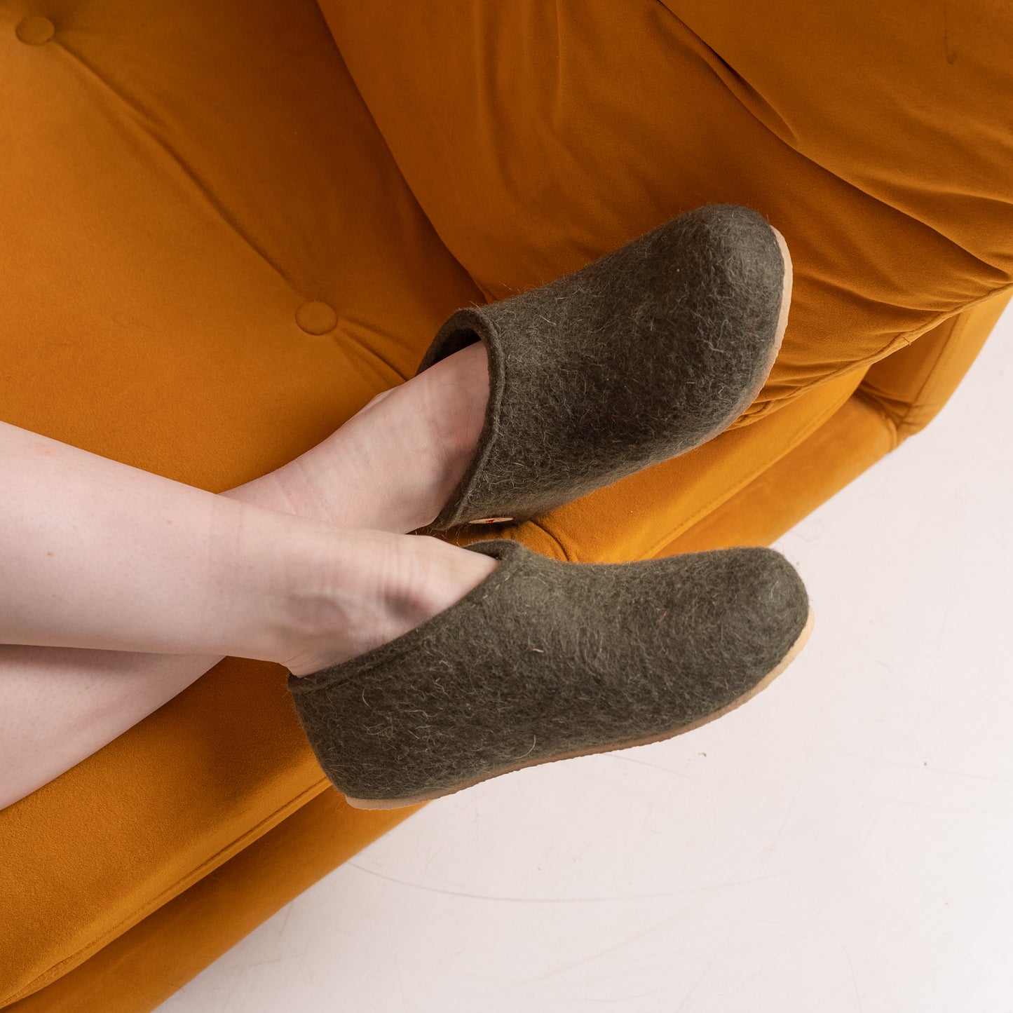 woman on the sofa in slippers